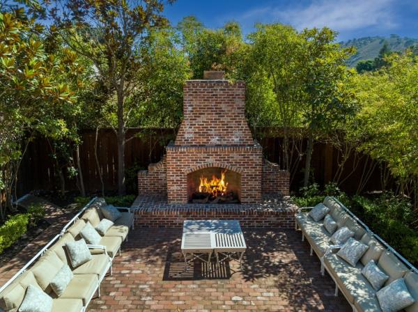 Outdoor seating and fireplace.